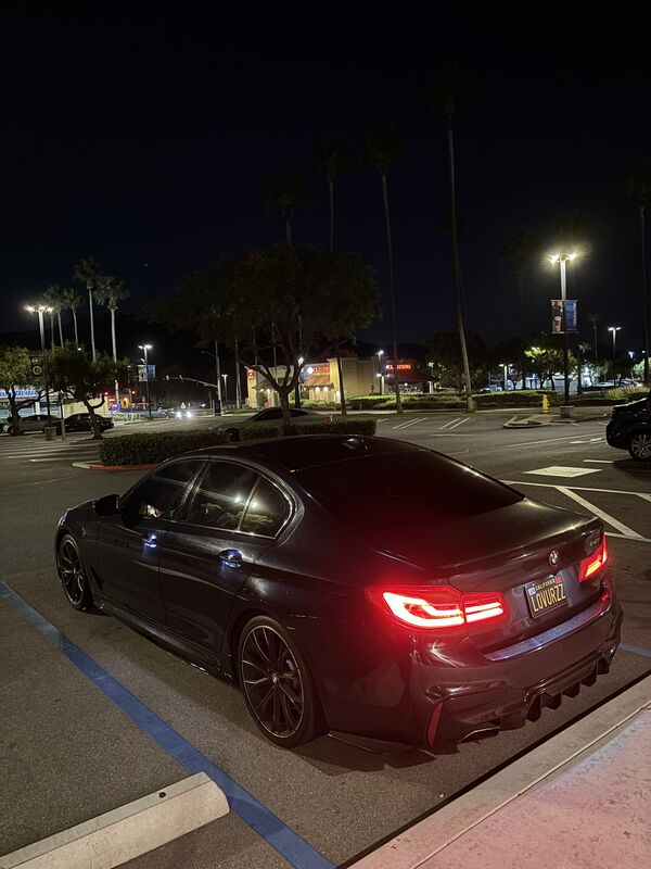 2017 BMW 540i rear view showing quad exhaust tips after muffler delete